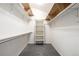 Walk-in closet with ample storage, shelving and gray carpet at 670 Somerset Dr, Golden, CO 80401