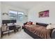 Cozy bedroom with great natural light, a comfortable bed, and a functional desk area at 7987 Yampa River Ave, Littleton, CO 80125
