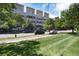 Exterior of a modern apartment building with green space at 7240 W Custer Ave # 307, Lakewood, CO 80226