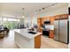 Modern kitchen features stainless steel appliances and an island with a white quartz countertop at 7240 W Custer Ave # 307, Lakewood, CO 80226