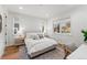 Light and airy bedroom with ample natural light and a sitting area at 3260 S Corona St, Englewood, CO 80113