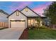 Modern farmhouse exterior with two-car garage at 3260 S Corona St, Englewood, CO 80113