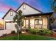 Craftsman style home with white siding, landscaping, and a covered porch at 3260 S Corona St, Englewood, CO 80113