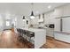 Modern kitchen with white cabinets, quartz countertops, and island at 3260 S Corona St, Englewood, CO 80113