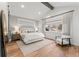 Main bedroom with vaulted ceiling, hardwood floors, and window seat at 3260 S Corona St, Englewood, CO 80113