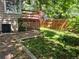 An exterior view of the backyard featuring a deck with an air conditioning unit at 2750 S Rifle St, Aurora, CO 80013