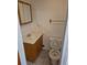 Small bathroom with vanity and toilet ready for a remodel at 2750 S Rifle St, Aurora, CO 80013