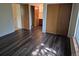 A primary bedroom features wood floors, large closets, and an ensuite bathroom at 2750 S Rifle St, Aurora, CO 80013