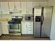 Practical kitchen featuring stainless steel appliances, neutral countertops, and sufficient storage space for cookware at 2750 S Rifle St, Aurora, CO 80013