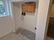 Laundry hookups with window above and cabinets for storage and supplies at 2750 S Rifle St, Aurora, CO 80013