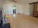 Cozy living room with hardwood floors, a fan, and a stone fireplace ready for your design vision at 2750 S Rifle St, Aurora, CO 80013
