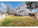 Fenced backyard featuring a well-maintained lawn, and the exterior of the home at 19257 E Legend Ave, Parker, CO 80134