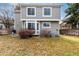 View of backyard with a gray home, partial fence, small bushes, grill and sparse ground cover at 19257 E Legend Ave, Parker, CO 80134