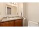 Bathroom with vanity, mirror, and white toilet at 19257 E Legend Ave, Parker, CO 80134