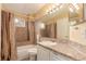 Standard bathroom featuring neutral colors, shower and tub with shower curtain, and sink at 19257 E Legend Ave, Parker, CO 80134