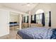 Bedroom with closet, large window, ceiling fan, and carpet at 19257 E Legend Ave, Parker, CO 80134