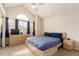 Bedroom with large window, ceiling fan, carpet, and dresser at 19257 E Legend Ave, Parker, CO 80134