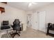 Bedroom with neutral carpet, desk, chair, closet and doorway to another room at 19257 E Legend Ave, Parker, CO 80134