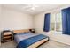 Bedroom with neutral carpet, a bed, side tables and a window at 19257 E Legend Ave, Parker, CO 80134