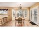 Sunny dining room with bay window, chandelier, and access to backyard with bar stool seating at 19257 E Legend Ave, Parker, CO 80134