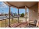 Relaxing front porch with wooden accents and serene neighborhood views offers a perfect spot for enjoying the outdoors at 19257 E Legend Ave, Parker, CO 80134