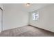 Bright bedroom features a neutral color scheme, carpet, and a window for natural light at 39420 Congress Ln, Elizabeth, CO 80107