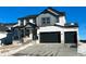 Two-story house with gray and white siding, a two-car garage, and a front porch at 39420 Congress Ln, Elizabeth, CO 80107