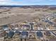Expansive aerial view of a residential community near rolling hills and open spaces, offering a serene living environment at 6065 Clover Ridge Cir, Castle Rock, CO 80104