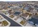 An aerial shot showcases the community with well-spaced homes, manicured lawns, and convenient street layouts at 6065 Clover Ridge Cir, Castle Rock, CO 80104