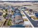 This neighborhood is well-designed, showcasing neatly arranged homes and maintained yards in an aerial view at 6065 Clover Ridge Cir, Castle Rock, CO 80104