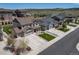 Neighborhood aerial view featuring well-maintained lawns, a three-car garage, and landscaping at 6065 Clover Ridge Cir, Castle Rock, CO 80104