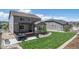 Well manicured back yard including a hot tub, deck with a pergola, fenced lawn, and landscaped border at 6065 Clover Ridge Cir, Castle Rock, CO 80104