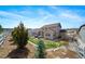 Well-manicured backyard featuring a lawn, deck, patio, and thoughtful landscaping at 6065 Clover Ridge Cir, Castle Rock, CO 80104