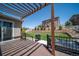 Relaxing backyard with pergola, hot tub, grill, and well-maintained lawn at 6065 Clover Ridge Cir, Castle Rock, CO 80104