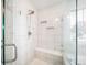 Bright and airy bathroom with glass-enclosed shower and tiled bench at 6065 Clover Ridge Cir, Castle Rock, CO 80104