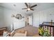 Well-designed Bedroom with crib, dresser, and decorations at 6065 Clover Ridge Cir, Castle Rock, CO 80104