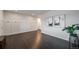 Entryway with hardwood floors, white wainscoting, and adjacent to a living space at 6065 Clover Ridge Cir, Castle Rock, CO 80104