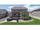 Exterior rear view with a hot tub on a patio, deck with pergola, and fenced yard with landscaping at 6065 Clover Ridge Cir, Castle Rock, CO 80104