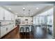 Bright kitchen featuring a large island with bar seating, stainless steel appliances, and granite countertops at 6065 Clover Ridge Cir, Castle Rock, CO 80104