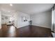 Spacious, empty living room with hardwood floors, ample natural light, and modern fixtures at 6065 Clover Ridge Cir, Castle Rock, CO 80104