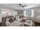 Open-concept living room flowing into a bright kitchen with a large island at 6065 Clover Ridge Cir, Castle Rock, CO 80104