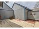 Enclosed backyard with concrete patio and brick accents provides a private outdoor space at 2488 S Victor St # E, Aurora, CO 80014