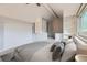 Bright bedroom with a ceiling fan, built-in shelving, and a cozy, inviting atmosphere at 2488 S Victor St # E, Aurora, CO 80014