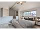 Charming bedroom with built-in shelves, a cozy ceiling fan, and natural light at 2488 S Victor St # E, Aurora, CO 80014