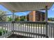 View from balcony includes mature landscaping and neighboring buildings at 8555 Fairmount Dr # C202, Denver, CO 80247