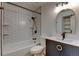Updated bathroom features modern fixtures, white subway tile in shower and bath, and stylish vanity at 8555 Fairmount Dr # C202, Denver, CO 80247