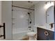 Updated bathroom features modern fixtures, white subway tile in shower and bath, and stylish vanity at 8555 Fairmount Dr # C202, Denver, CO 80247