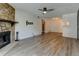The spacious living room features a stone fireplace and an open layout at 8555 Fairmount Dr # C202, Denver, CO 80247