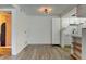 Bright living room with modern flooring, neutral paint, and contemporary light fixture at 8555 Fairmount Dr # C202, Denver, CO 80247