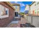 View of the backyard with brick and siding exterior and a stone pathway at 14641 E Poundstone Dr, Aurora, CO 80015